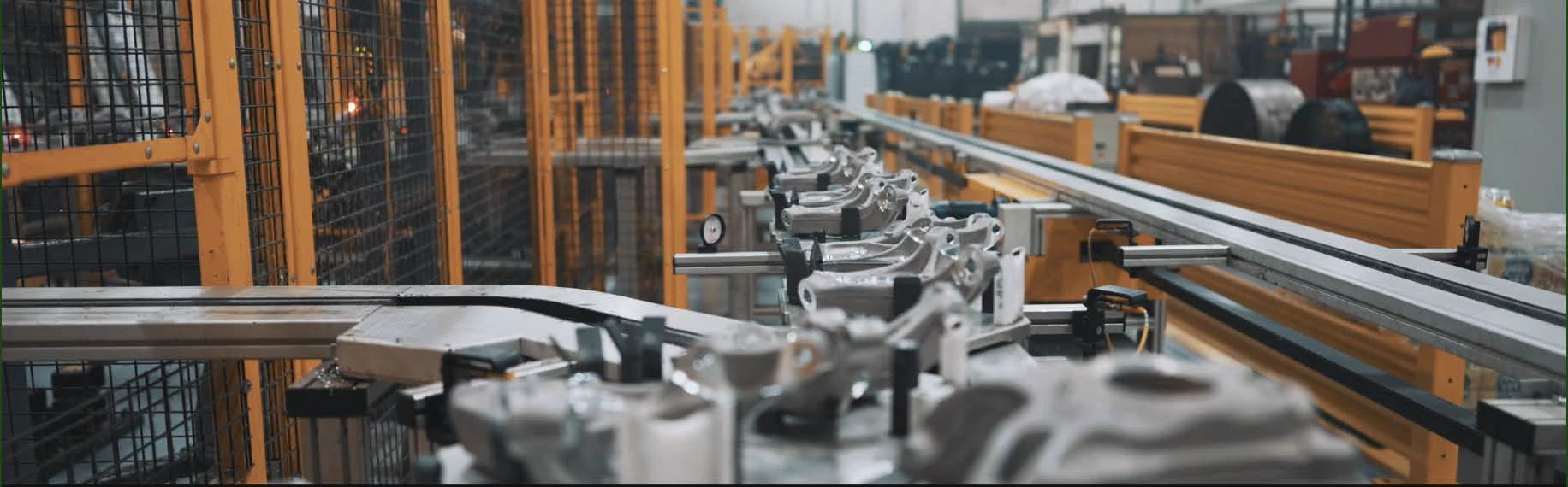 Automated manufacturing equipment moving through a production line